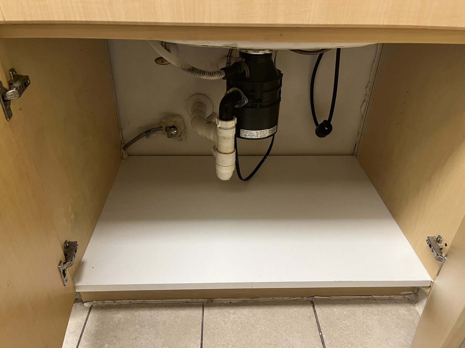 Under-sink cabinet base rebuilt clean