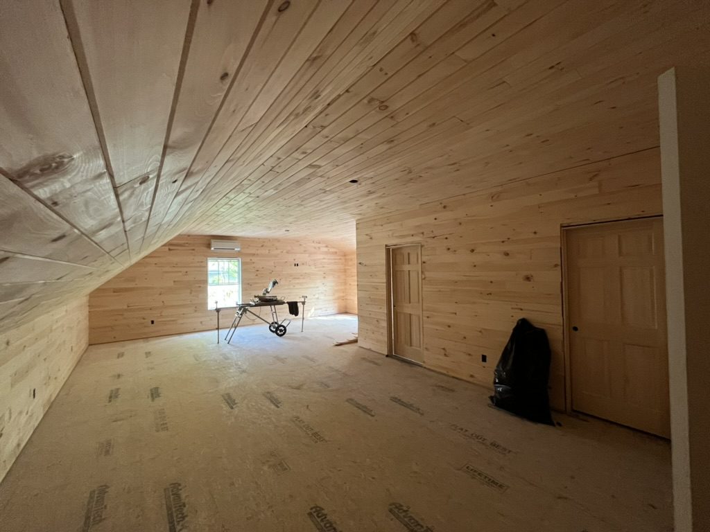 Finished pine tongue-and-groove loft room
