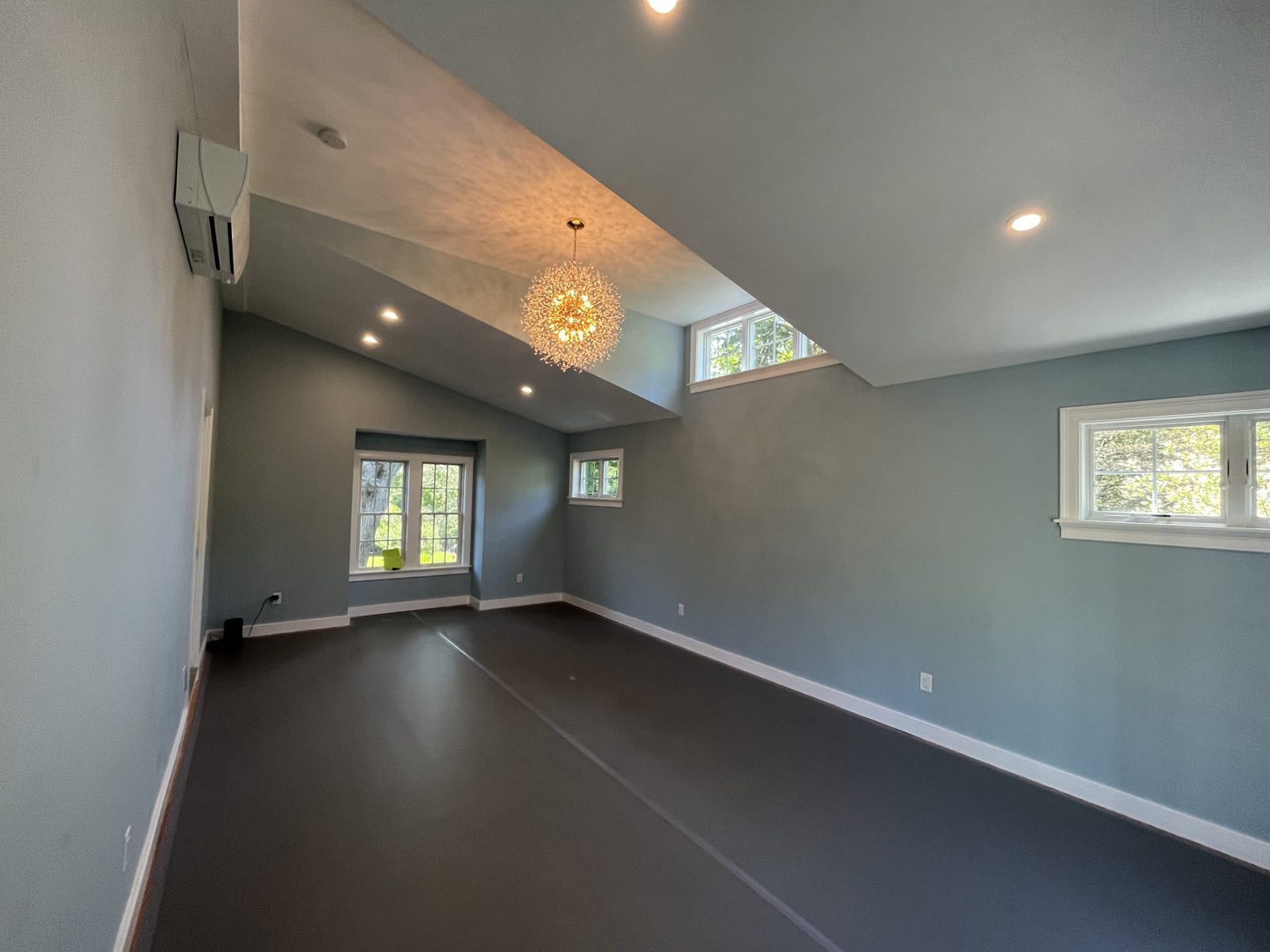 Finished vaulted room with recessed lighting